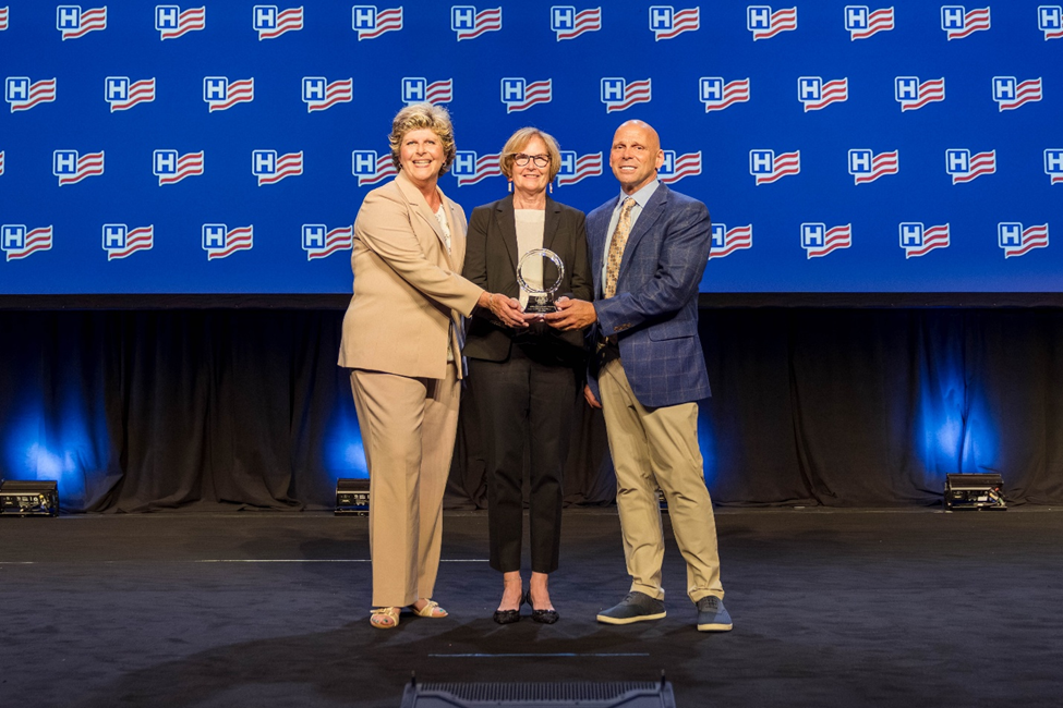Gilchrist Hospice Care accepts their Circle of Life Award at the 2025 AHA Leadership Summit.
