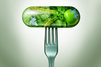 3 Ways to Strengthen Food Is Medicine Initiatives. A silver fork holds a pharmaceutical capsule filled with green fruits and vegetables.