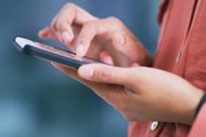 MasterCard, Verizon Make Initial Forays into Health Care. A patient users her mobile phone to access a telehealth app.