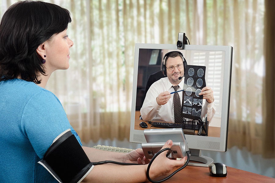 Digital Transformation and Technology Patient and clinician reviewing health information by telehealth