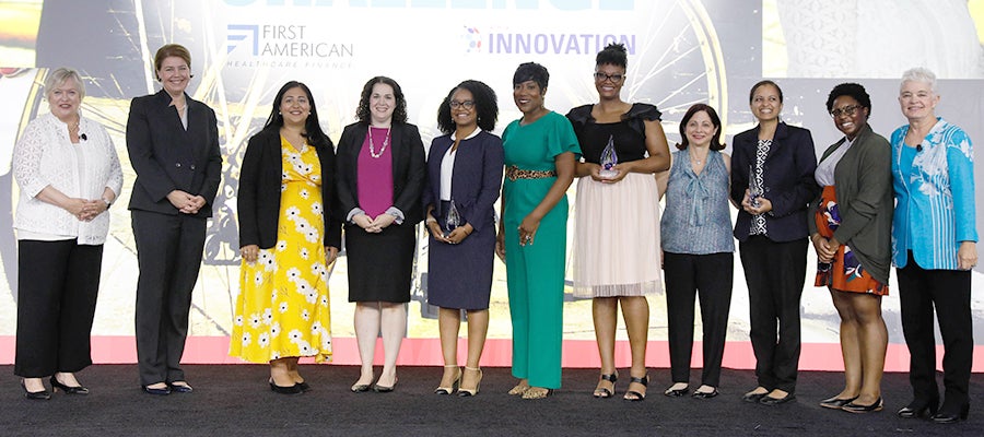The three winners of the Innovation Challenge on stage with their awards at the 2019 AHA Leadership Summit.