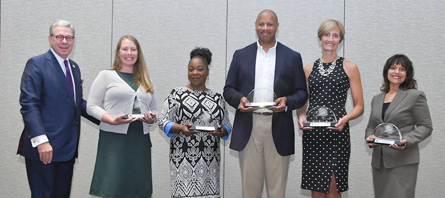 NOVA Award Winners with awards at the 2019 AHA Leadership Summit.