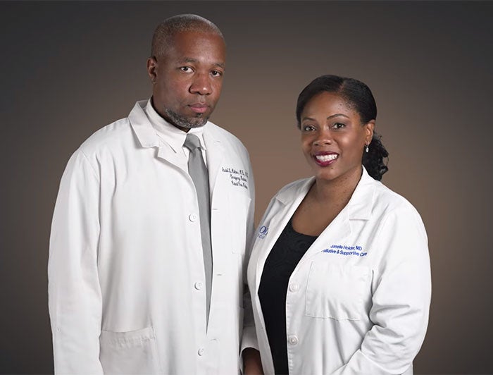 Video still of a male and female Emory physician