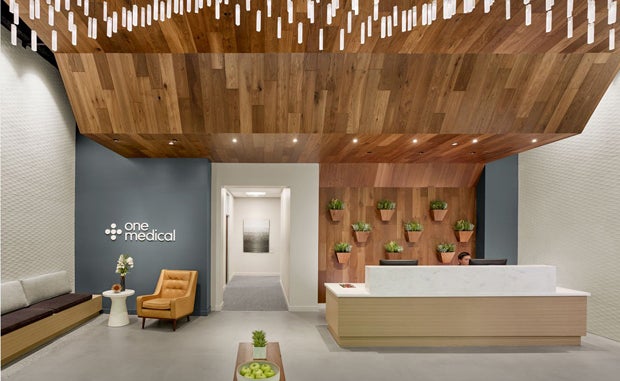 Can Concierge Care Achieve Its Potential? A One Medical reception area with a receiving desk.