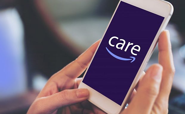 Amazon Care’s Vision: Access to a Clinician in 60 Seconds, In-Person Care within an Hour. A user has the Amazon Care app displayed on her mobile phone.