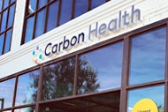 Primary Care at Medicare Rates: One Startup’s Recipe for Expansion. Carbon Health logo on a building.