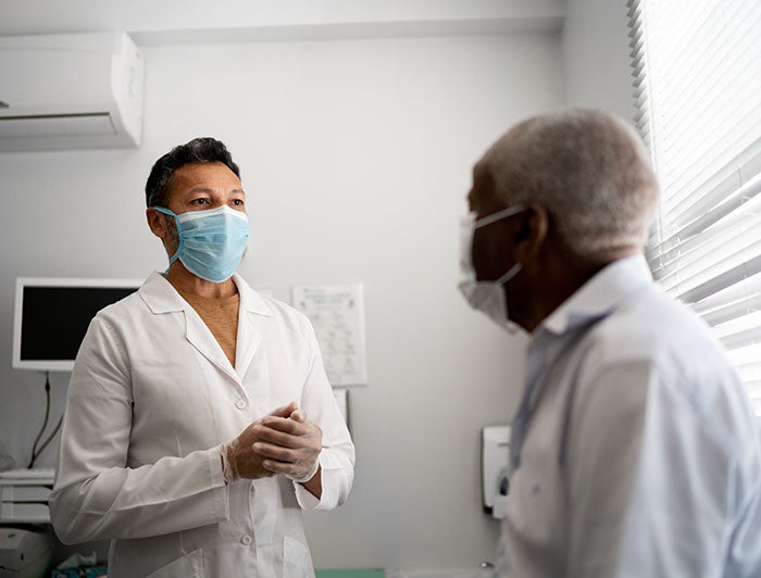 Stock photo of doctor and patient in exam room