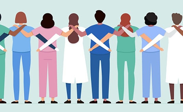Intermountain, Northwell Health Workforce Collaboration Spawns a Nationwide Alliance. A diverse group of clinicians with their arms around each other shoulders and waists viewed from behind.