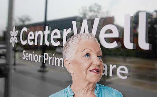 Humana to Double Down on Value-Based Primary Care Clinics Targeting Medicare Patients. An older woman stands in front of a window that has CenterWell Senior Primary Care on it.