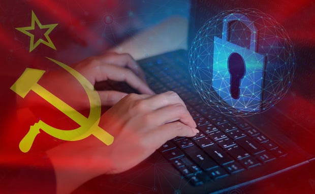It’s Time to Make Cybersecurity a Leadership Imperative. A Russian hammer and sickle and star with hands typing on a laptop computer and a cyber security lock and globe displayed on the screen.