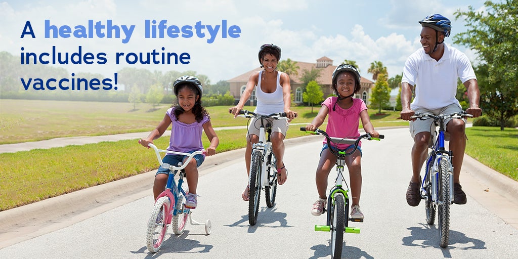 Black family of 4 rides bikes together down a suburban road. Text: A healthy lifestyle includes routine vaccines.
