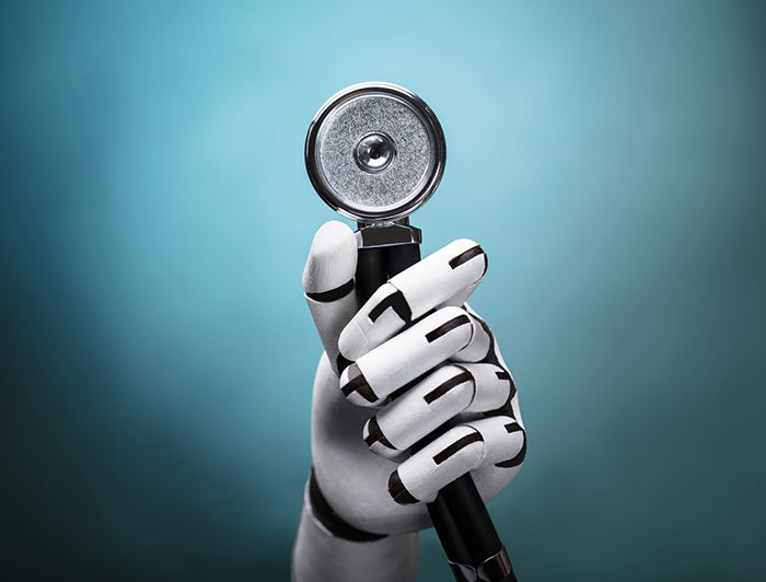 robot hand holding stethoscope