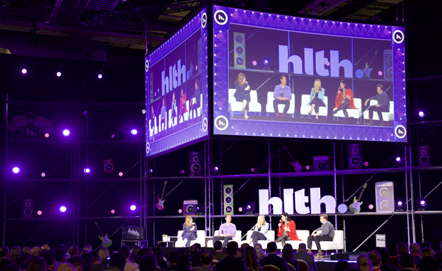 3 Takeaways from the HLTH Conference. A panel onstage at the HLTH Conference.