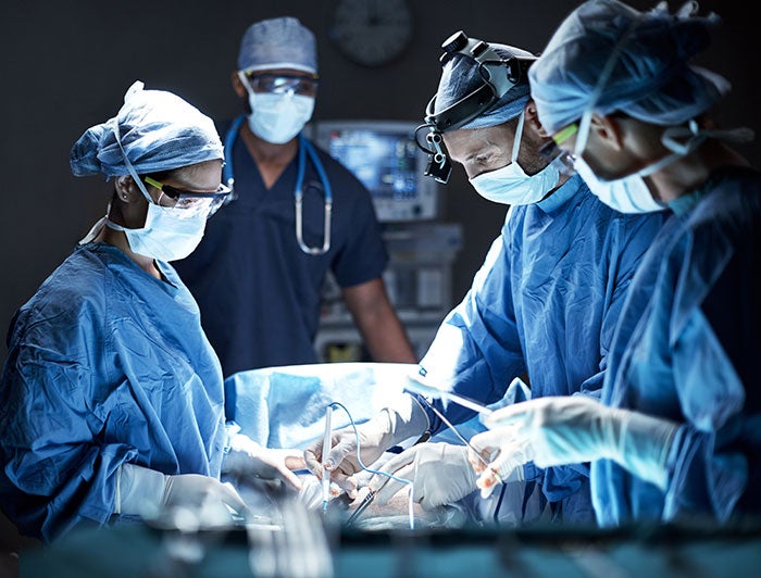 New Mexico Lovelace Medical Center. Stock photo of surgeons operating in theater
