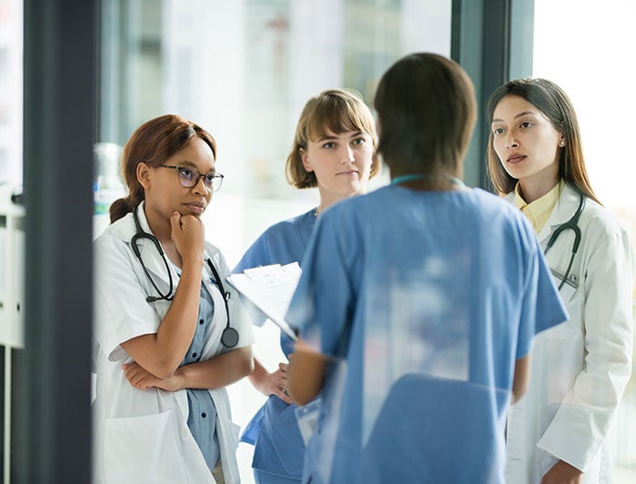 Banner Health Phoenix. Stock image of 4 female clinicians in conversation