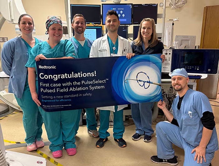 Saint Francis medical team holds sign from Medtronic declaring the first case use of PulseSelect Pulsed Field Ablation System