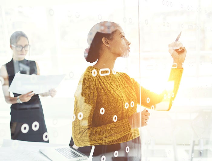 Person with a board with many sticky notes for planning