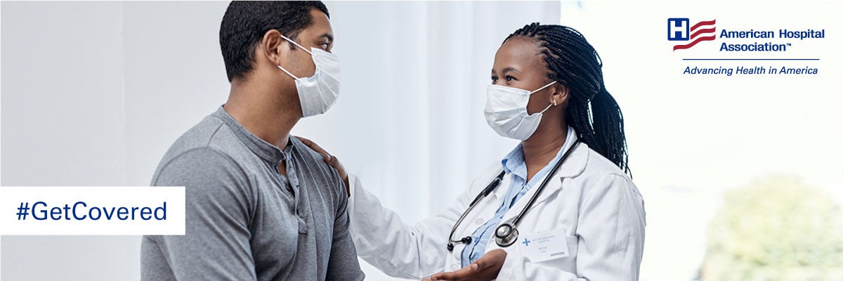 Enroll in Health Insurance. American Hospital Association. #GetCovered. A female physician wearing a mask is talking to a male patient wearing a mask. 