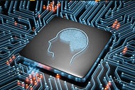 AI Coalition Plans to Transform the Field Through Responsible Adoption. A microchip with an icon of a human head with the brain visible etched on it. The microchip is on a circuit board.