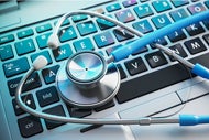 Private Equity Firm Raises $1.4 Billion for Hit Investment Fund. A stethoscope on a laptop keyboard.