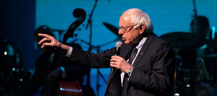 Image of Bernie Sanders holding mic and gesturing