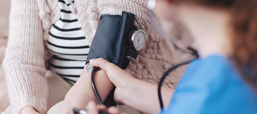 nurse taking blood pressure