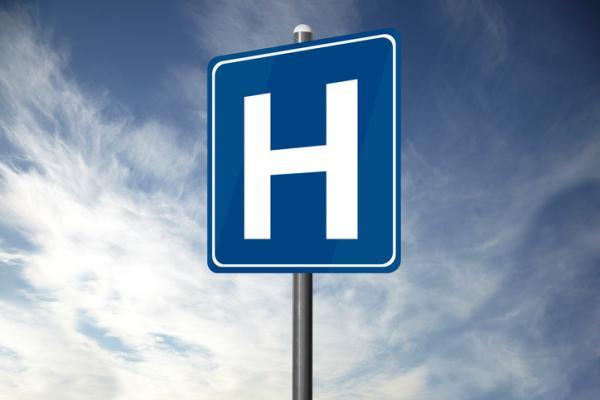 A blue H for hospital sign
